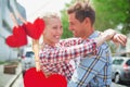 Composite image of couple in check shirts and denim hugging each other Royalty Free Stock Photo