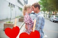 Composite image of couple in check shirts and denim hugging each other Royalty Free Stock Photo