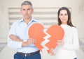 Composite image of couple holding broken heart Royalty Free Stock Photo