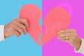 Composite image of couple holding a broken paper heart Royalty Free Stock Photo