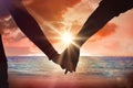 Composite image of couple holding hands rear view Royalty Free Stock Photo