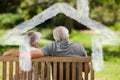 Composite image of couple sitting on the bench with their back to the camera Royalty Free Stock Photo