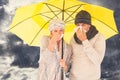 Composite image of couple sneezing in tissue while standing under umbrella Royalty Free Stock Photo