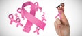 Composite image of cropped hand of woman with pnik breast cancer awareness ribbon Royalty Free Stock Photo