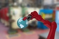 Composite image of cropped image of red robot hand holding earth 3d Royalty Free Stock Photo