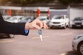 Composite image of customer receiving car keys Royalty Free Stock Photo