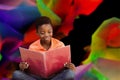 Composite image of cute boy reading book in library Royalty Free Stock Photo