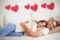 Composite image of cute couple relaxing on couch Royalty Free Stock Photo