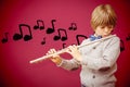 Composite image of cute pupil playing flute