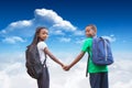 Composite image of cute pupils holding hands Royalty Free Stock Photo