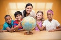 Composite image of cute pupils and teacher looking at globe in library Royalty Free Stock Photo