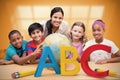 Composite image of cute pupils and teacher looking at globe in library Royalty Free Stock Photo