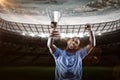 Composite image 3D of happy sportsman looking up and cheering while holding trophy Royalty Free Stock Photo