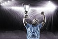 Composite image 3D of happy sportsman looking up and cheering while holding trophy Royalty Free Stock Photo