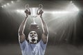 Composite image 3D of happy sportsman looking up while holding trophy Royalty Free Stock Photo