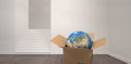 Composite image of 3d image of globe in cardboard box Royalty Free Stock Photo