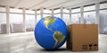 Composite image of 3d image of planet earth by cardboard box Royalty Free Stock Photo