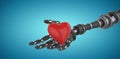 Composite image of 3d image of robot hand holding heard shape decoration 3d Royalty Free Stock Photo