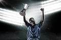 Composite image 3D of portrait of happy sportsman cheering while holding trophy Royalty Free Stock Photo