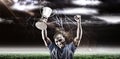 Composite image 3D of portrait of happy sportsman cheering while holding trophy Royalty Free Stock Photo