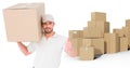 Composite image of delivery man with cardboard box gesturing thumbs up Royalty Free Stock Photo