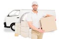 Composite image of delivery man carrying cardboard box Royalty Free Stock Photo