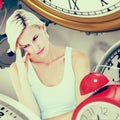 Composite image of depressed blonde woman with hand on temple