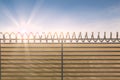 Composite image of digitallly generated image of barbed wire on fence Royalty Free Stock Photo