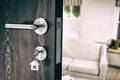 Composite image of digitally generated image of brown door with key Royalty Free Stock Photo