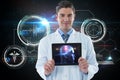 Composite image of doctor showing digital table Royalty Free Stock Photo