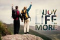 Composite image of excited couple reaching the top of their hike and cheering