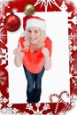 Composite image of fairhaired woman putting her thumbs up while wearing christmas clothes