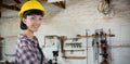 Composite image of female architect in hard hat standing against white background Royalty Free Stock Photo