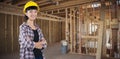 Composite image of female architect standing with arms crossed against white background Royalty Free Stock Photo