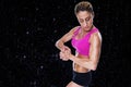 Composite image of female bodybuilder flexing in pink sports bra