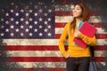 Composite image of female college student with books in park Royalty Free Stock Photo