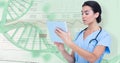 Composite image of female doctor using digital tablet Royalty Free Stock Photo