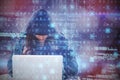 Composite image of female hacker using laptop Royalty Free Stock Photo