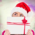 Composite image of festive blonde holding christmas gift Royalty Free Stock Photo