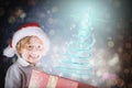 Composite image of festive boy opening gift Royalty Free Stock Photo