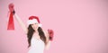 Composite image of festive brunette in boxing gloves with shopping bag Royalty Free Stock Photo