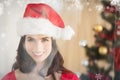 Composite image of festive brunette posing at christmas