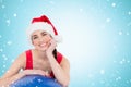 Composite image of festive fit brunette leaning on exercise ball Royalty Free Stock Photo