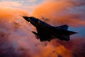 Composite image of fighter jet aircraft silhouette against orange clouds Royalty Free Stock Photo