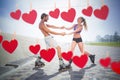 Composite image of fit couple rollerblading together on the promenade Royalty Free Stock Photo