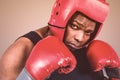 Composite image of fit man boxing with gloves Royalty Free Stock Photo