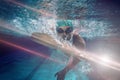 Composite image of fit swimmer training by himself Royalty Free Stock Photo