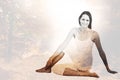 Composite image of fit woman doing the half spinal twist pose in fitness studio Royalty Free Stock Photo