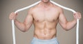 Composite image of Fitness Torso against grey background Royalty Free Stock Photo