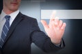 Composite image of focused businessman pointing with his finger Royalty Free Stock Photo